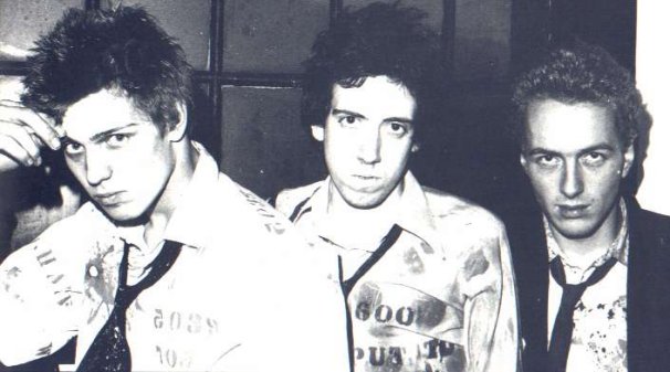 The Clash looking overjoyed at 25 quid a week! - (Don't Care colection)