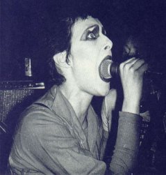 Siouxsie getting a mouthful of mic. - (Dont Care collection) 